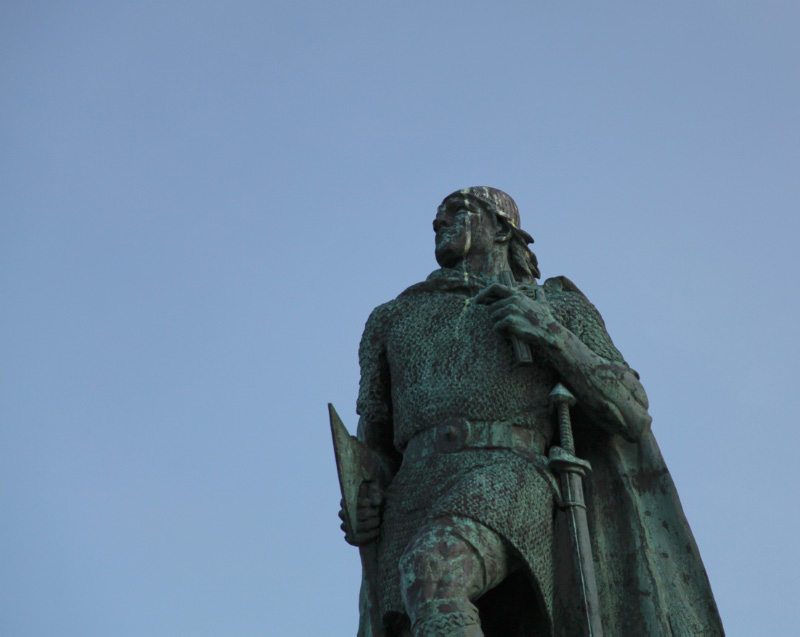 Hallgrímskirkja and Leifr Eiríksson sculpture by A.S. Calder with Cross and in chainmail with sword and battleaxe